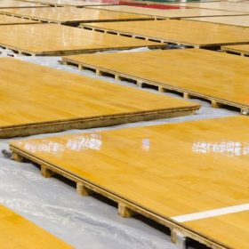 Basketball and hardwood maple basketball court floor viewed from above ... Basketball and hardwood maple basketball court floor viewed from above ...
