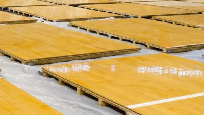 Basketball and hardwood maple basketball court floor viewed from above ...
