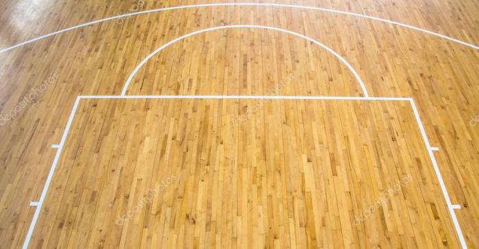Top view of a parquet basketball court with hoops installed and ... Top view of a parquet basketball court with hoops installed and ...