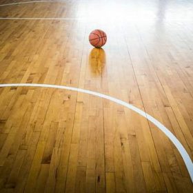 Top view of a parquet basketball court with hoops installed and ...