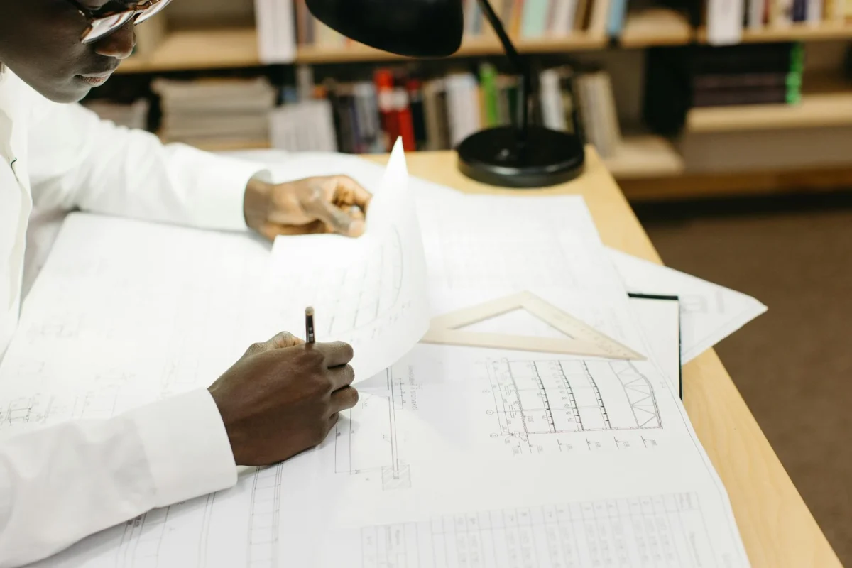Architectural Blueprint Calculator On Desk