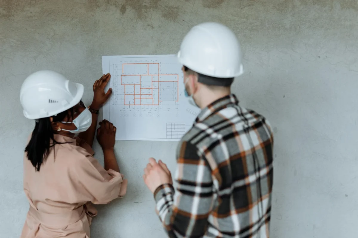 Foto oleh Thirdman di Pexels Blueprints Construction Site