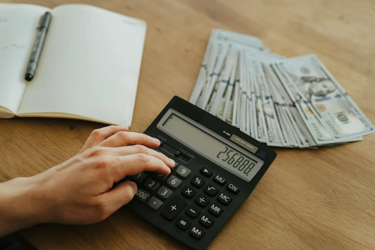 Foto oleh olia danilevich di Pexels Calculator Money Contract
