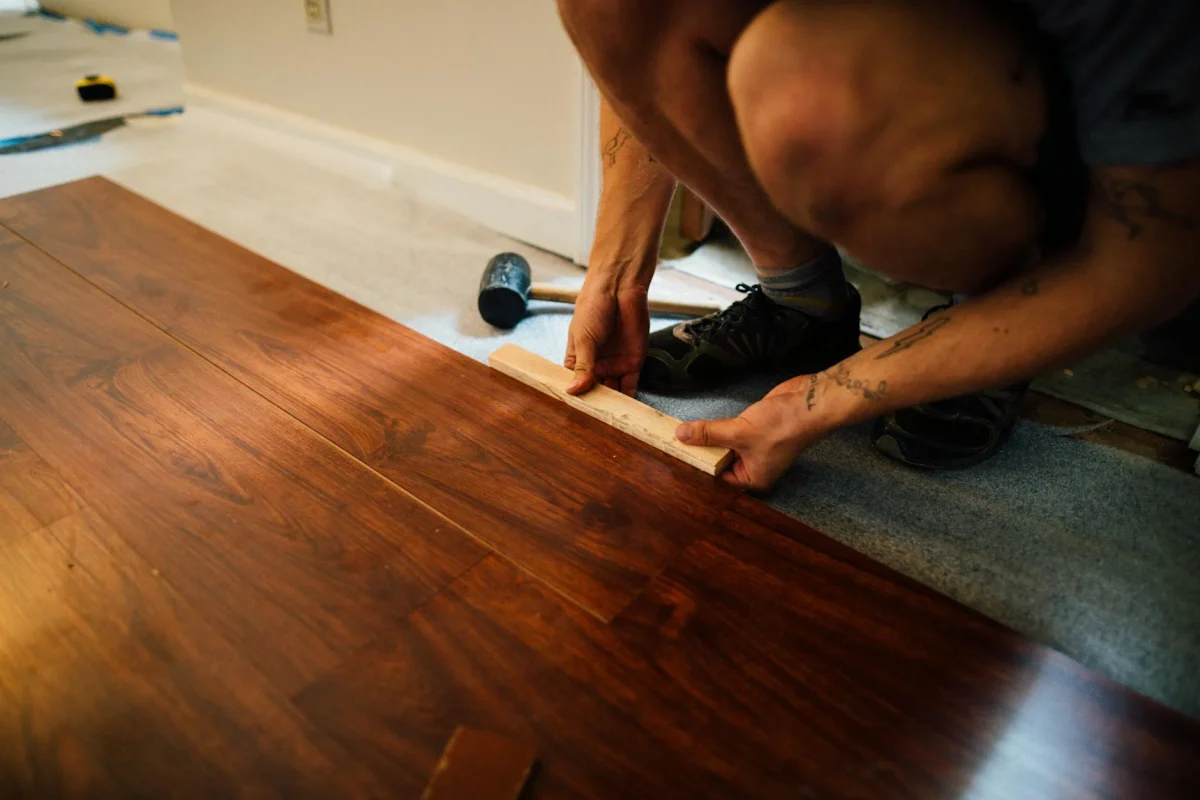 Pilihan Warna Lantai Parket Kayu Minimalis Terbaru 2026 4 Flooring Installation Process Worker Installing Wood