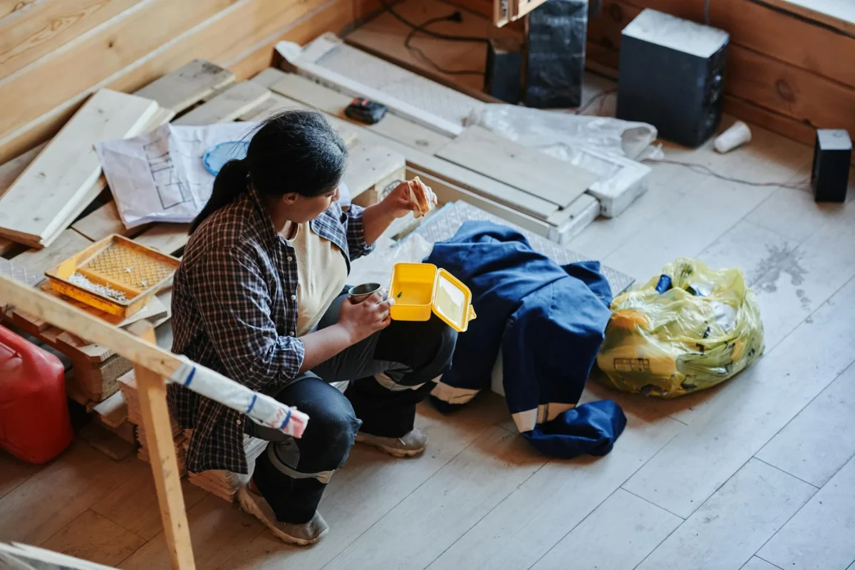 Worker Installing Floor Wooden Planks